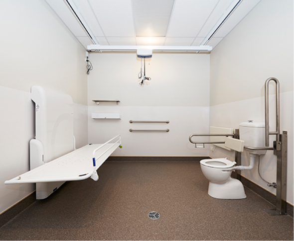 Accessible bathroom showing toilet and change table